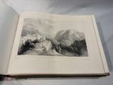an open book with a picture of a castle on it
