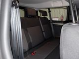 a seat in the back of a van with the door open