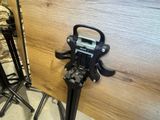 a camera on a tripod next to a tripod stand