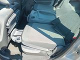the back seats of a car with luggage in the back of it