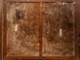 an old wooden cabinet with two doors in the room