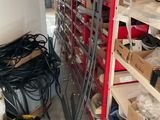 a room filled with lots of shelves and tools