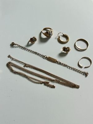 a lot of rings and bracelets on the table