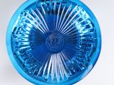 a blue glass bowl with a circular design on it