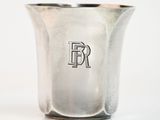 a silver cup with the letter r on it