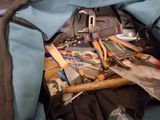 a bag with a bunch of tools inside of it