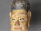 an image of a wooden mask on a table