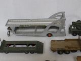 a lot of toy vehicles and a bus on a table