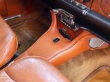a brown leather car dashboard and tan leather seats