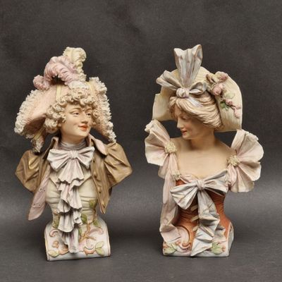 pair of porcelain figurines of a woman and a man