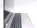 a close up of a laptop computer on a white surface
