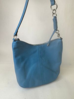 blue leather purse with chain strap on a white background
