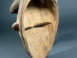 wooden sculpture of a fish with a hook on it ' s back