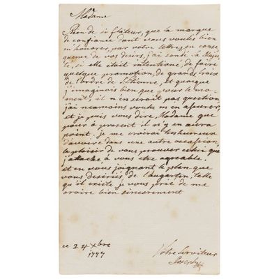 une lettre écrite à l'encre noire sur une feuille de papier