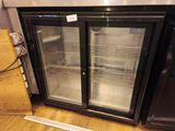 two glass doors that are open on the side of a refrigerator