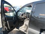 a black van with the door open in a parking lot