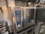 a commercial kitchen with a lot of stainless steel appliances