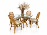 a glass table with four chairs and a vase with flowers on it