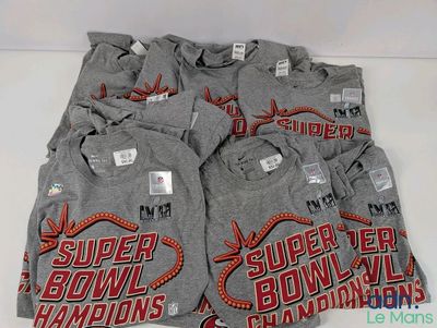 six super bowl champs t - shirts are stacked on top of each other