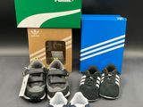 a box of children ' s shoes and a box of shoes