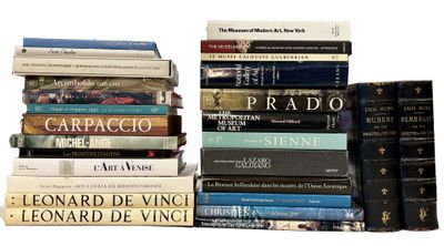 many books stacked on top of each other on a table