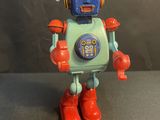 a toy robot that is sitting on a table
