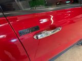 a close up of a car door handle with a sticker on it
