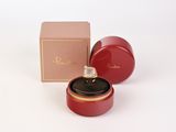 a small red box with a ring inside of it
