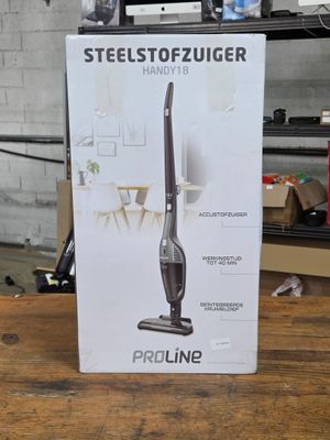 the box of the vacuum is open on the table in the room