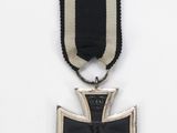 an iron cross medal with a black and white ribbon on a white background