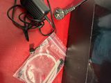 a picture of a tv and a charger on a red wall