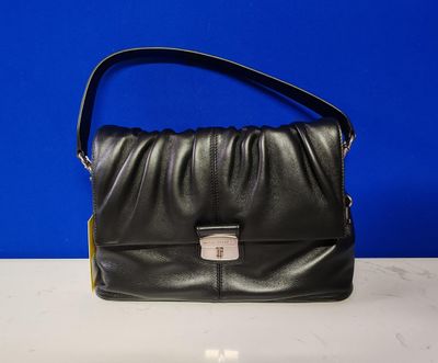 a black leather purse with a metal clasp on the front
