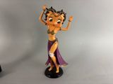 a figurine of a woman in a purple dress