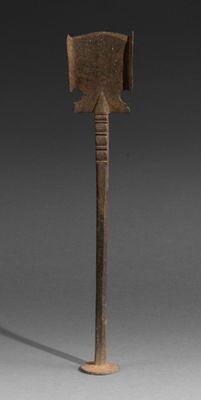 an old wooden axe with a wooden handle on a gray background