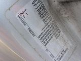 a close up of a car ' s tire with a sticker on it