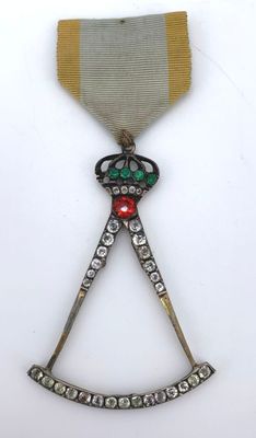 a close up of a medal with a ribbon on it