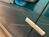 a sticker on the door of a car that has a sticker on it