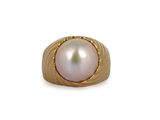 an image of a gold ring with a pearl in the center