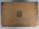 an old wooden box with a metal latch on it