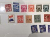 many different stamps on display in a glass case