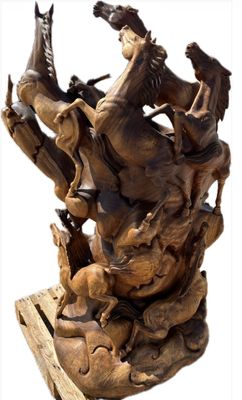 statue of a man on a horse and a dog on a wooden base
