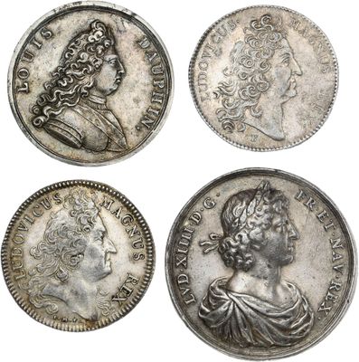 four roman silver coins, one of which has a bust and the other of which is a bust