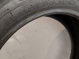 a close up of a tire on a white surface