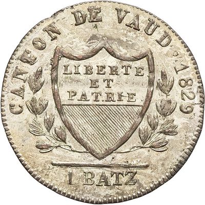 a close up of a coin with a coat of arms on it