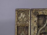 a sculpture of a woman and a man inside of a box