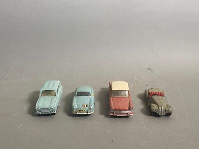 several toy cars are lined up in a row on a table