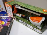 a toy gun in the box on the table