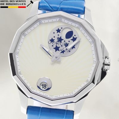 a close up of a wrist watch with a blue strap