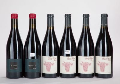 six bottles of red wine are lined up in a row