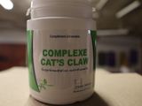 a container of complex cat ' s clean sitting on a table